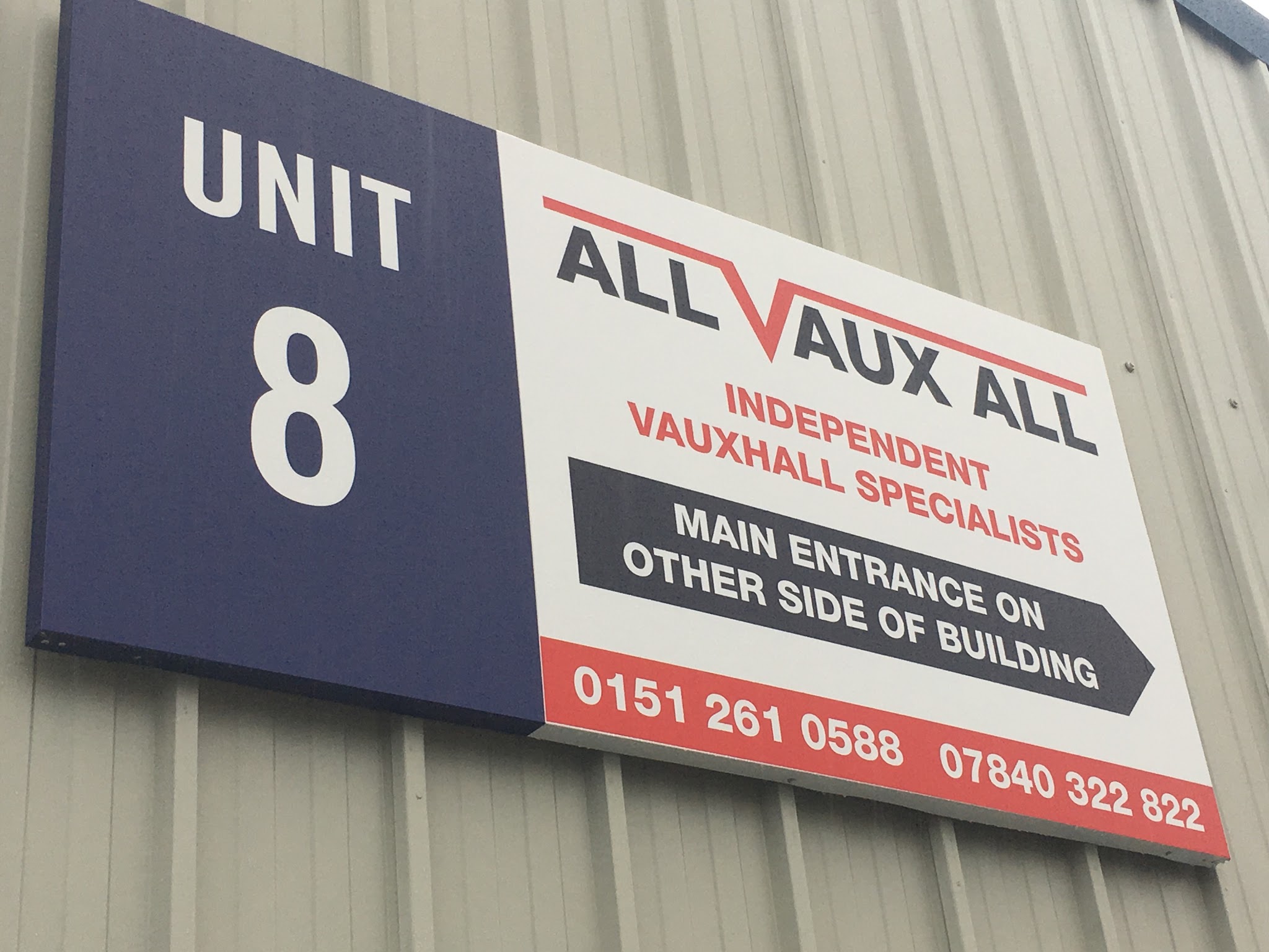 The Unit 8 sign on the cladding: All Vaux All, Independent Vauxhall Specialists, main entrance on other side of building